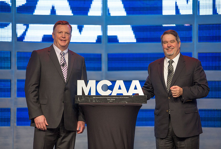 MCAA President Greg L. Fuller presents Immediate Past President Tom Stone with a token of appreciation for his service.